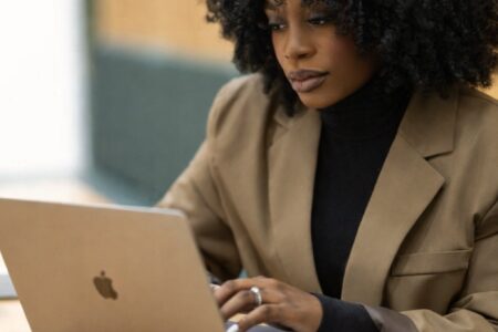 busy professional working online while using Telehealth services like Proxy Medicine